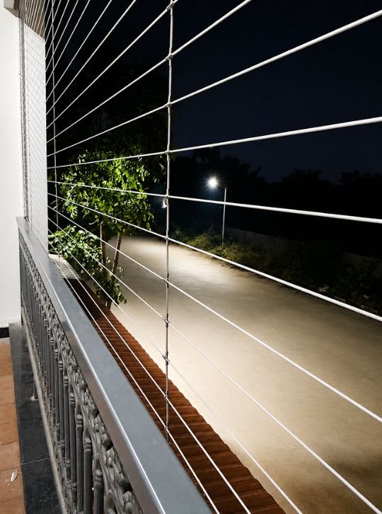 KNR Safety Solutions team installing invisible grills at a Andhra Pradesh apartment